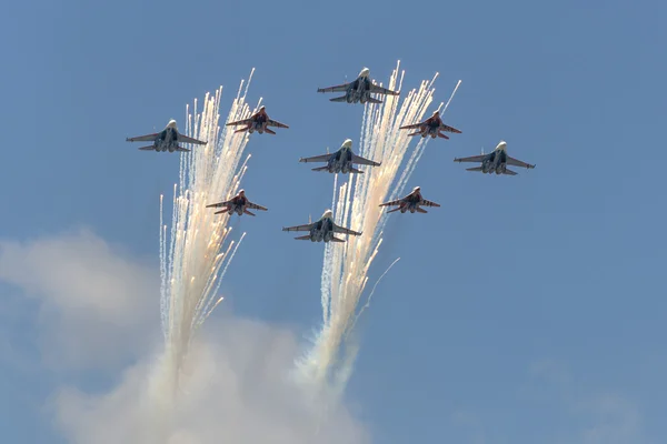 Salute Aerobatic team Swifts and Russian Knights fly over Red Square