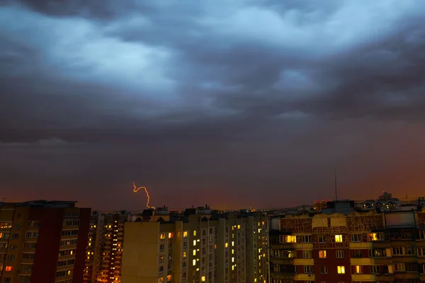 Storm clouds, heavy rain. Thunderstorm and lightning over the city.