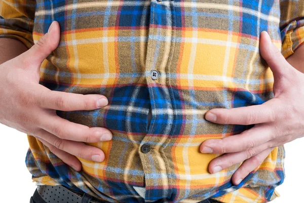 Close-up of man suffering from abdominal or stomach pain