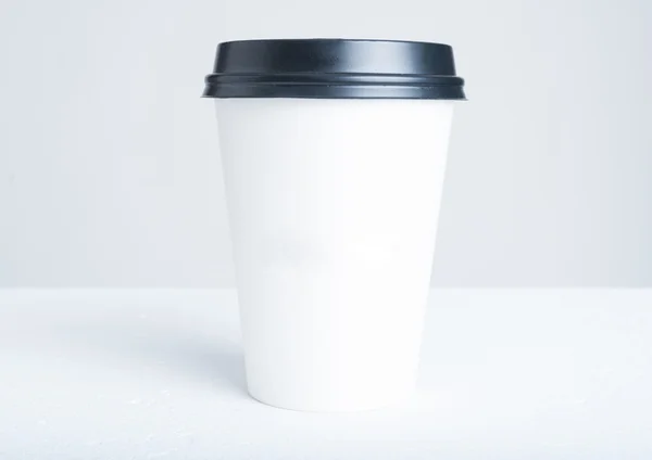 Break time coffee concept with paper cup with plastic top