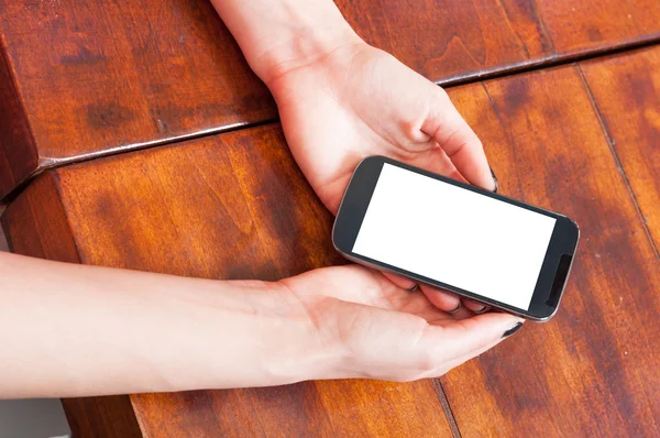 Close-up of woman hands holding smartphone blank screen