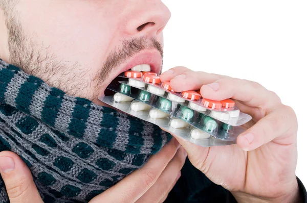 Man taking many blisters with pills