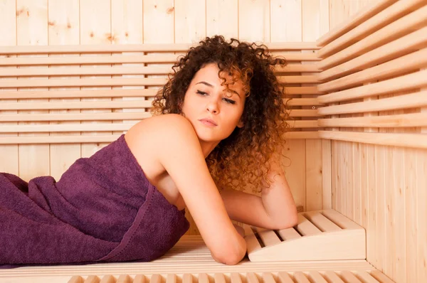 Close-up portrait of attractive woman resting in a steam room