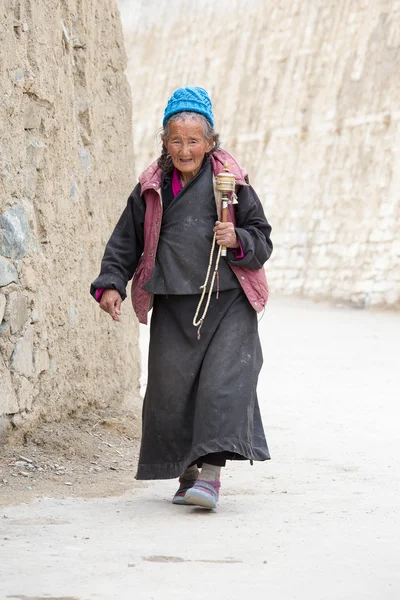 Tibetan old women during mystical mask dancing Tsam mystery dance in time of Yuru Kabgyat Buddhist festival at Lamayuru Gompa, Ladakh, North India