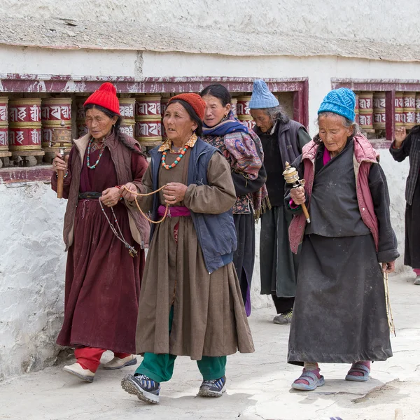 Tibetan old women during mystical mask dancing Tsam mystery dance in time of Yuru Kabgyat Buddhist festival at Lamayuru Gompa, Ladakh, North India