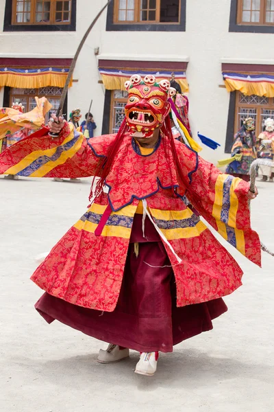 Tibetan lama dressed in mask dancing Tsam mystery dance on Buddhist festival at Hemis Gompa. Ladakh, North India