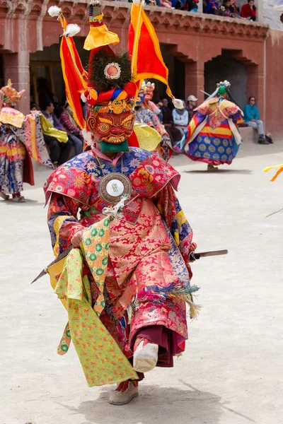 Tibetan lama dressed in mask dancing Tsam mystery dance on Buddhist festival at Hemis Gompa. Ladakh, North India