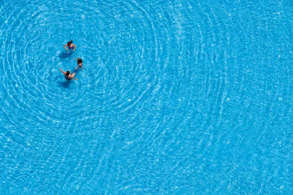 Three women swim in the swimming pool at the hotel. Istanbul, Turkey