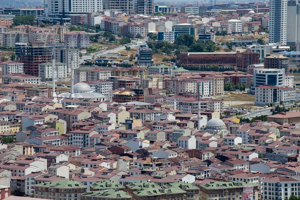 Top urban view of lots  houses in Istanbul city, Turkey. Crowded red roofs and mosque.