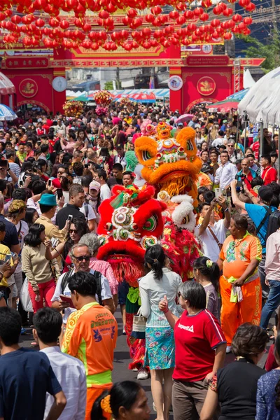 Crowd of people roams the street  Yaowarat during the celebration  Chinese New Year and Valentine\'s Day. Chinatown in Bangkok, Thailand