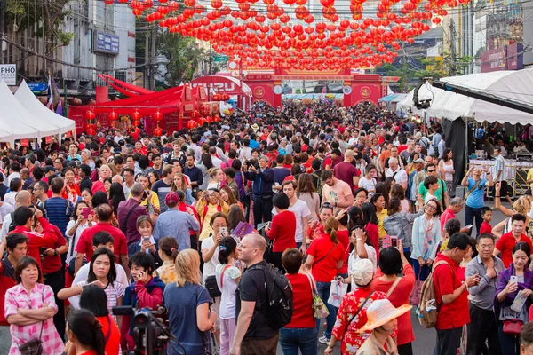 Crowd of people roams the street  Yaowarat during the celebration  Chinese New Year and Valentine\'s Day. Chinatown in Bangkok, Thailand