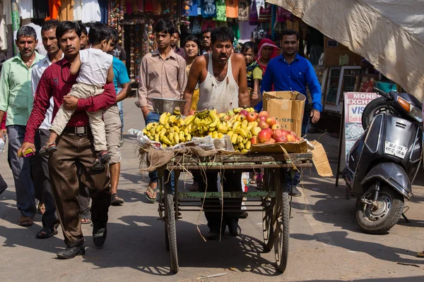 Indian man sells fruit on the street in Pushkar, India