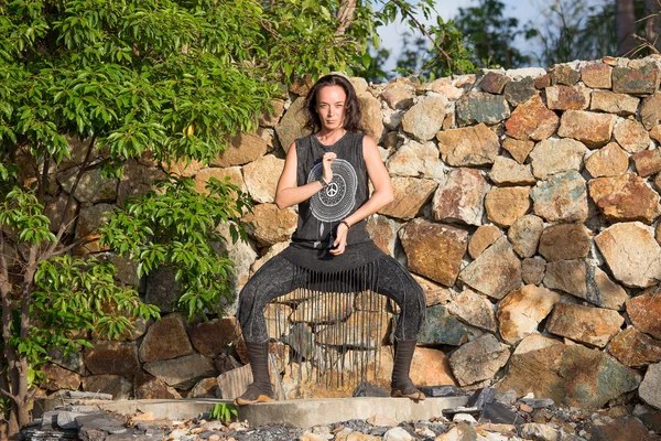 Young woman doing shamanic dance in nature