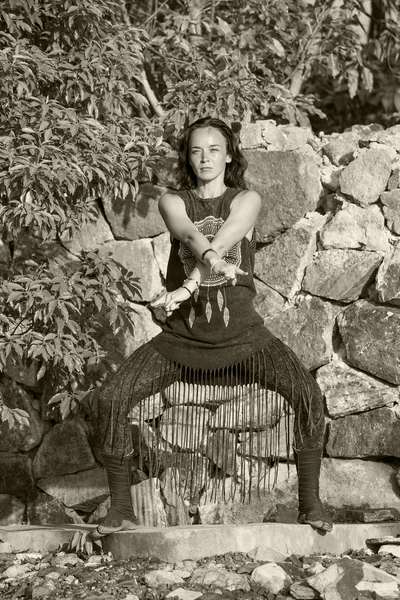 Young woman doing shamanic dance in nature.