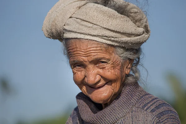 Old poor woman to Bali island.