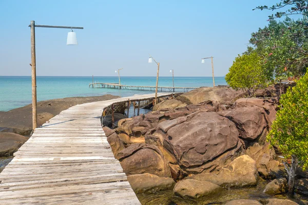 Wooden pier on the beautiful tropical beach in island Koh Kood , Thailand