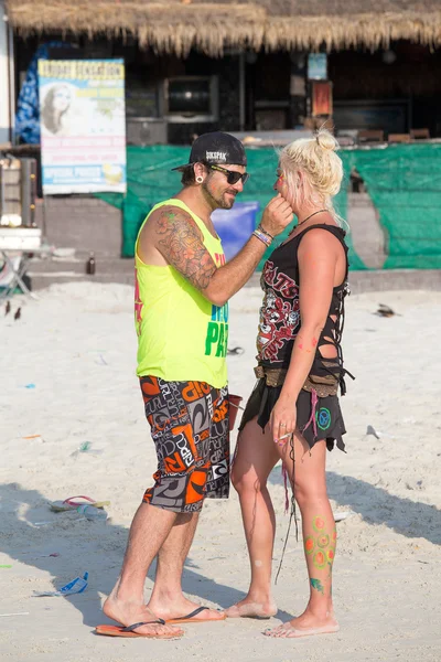 Man and women participate in the Full Moon party on island Koh Phangan.  Thailand