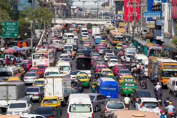 Traffic moves slowly along a busy road in Bangkok, Thailand.