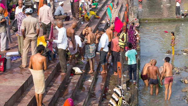 Indian people at ritual washing in the sacred Ganges river. Haridwar , India
