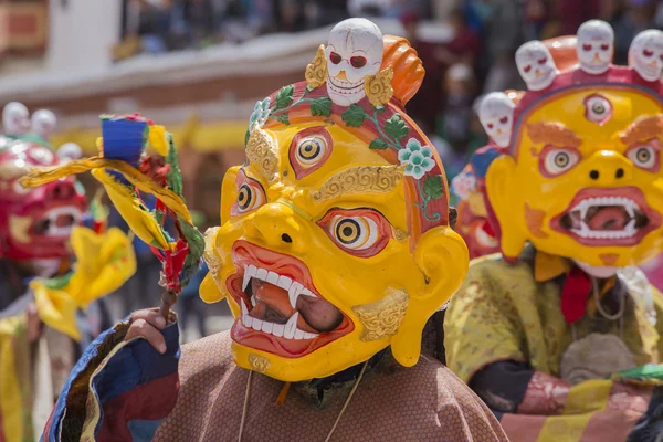 Tibetan Buddhist lamas in the mystical masks perform a ritual Tsam dance . Hemis monastery, Ladakh, India