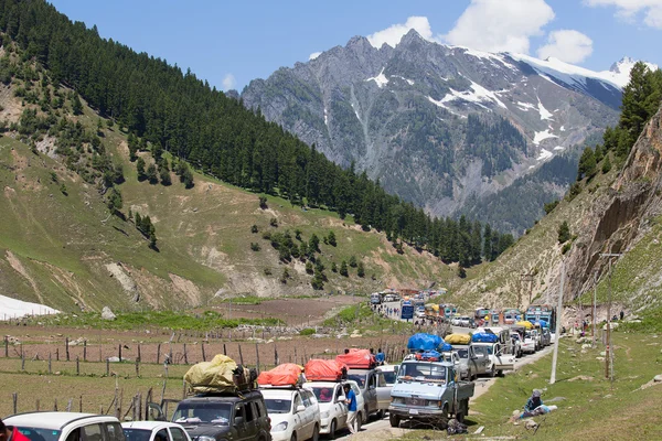 Cars with passengers stuck at the pass on the way Srinagar - Leh, Himalayas. India