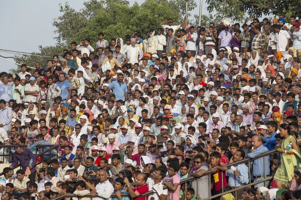 Indian people preparing to celebrate daily closing of Indian - Pakistani border . Attari, India