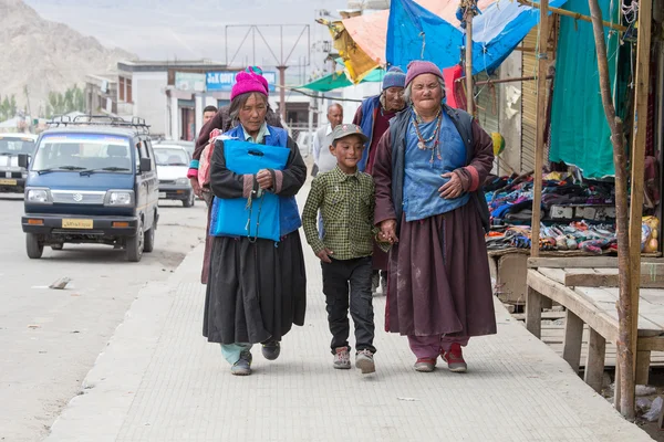 Tibetan Buddhist old women and boy on the streets in Leh. Ladakh, North India