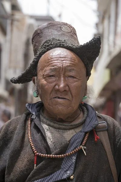 Tibetan Buddhist old man on the streets in Leh. Ladakh, North India