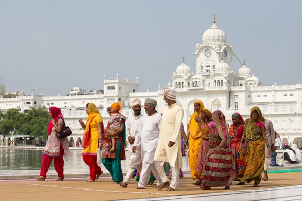 Sikhs and indian people visiting the Golden Temple in Amritsar, Punjab, India.