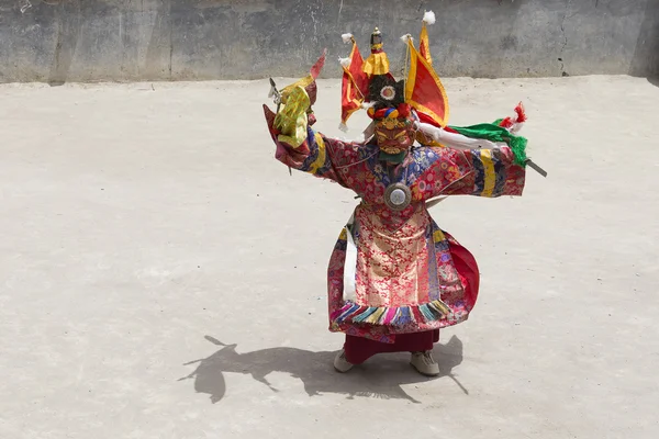 Tibetan lamas dressed in mystical mask dancing Tsam mystery dance in time of Yuru Kabgyat Buddhist festival at Hemis Gompa, Ladakh, North India