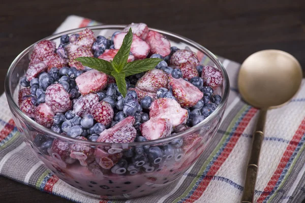 Fresh fruit salad with strawberries and blueberries , wild berry