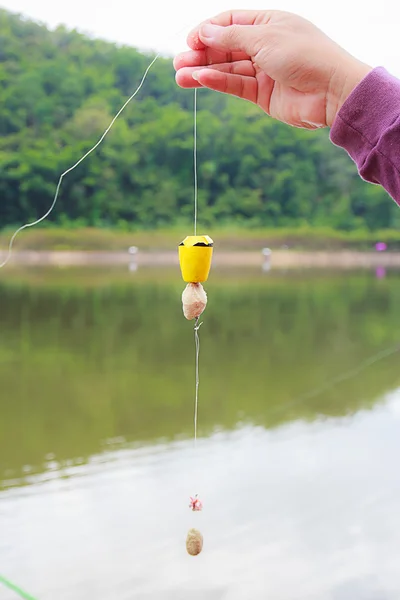 Hand holding fishing line