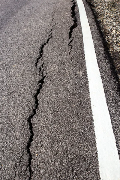 The road has cracks.