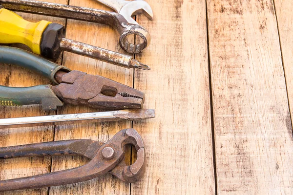 Close up bunch of used tools on wooden table