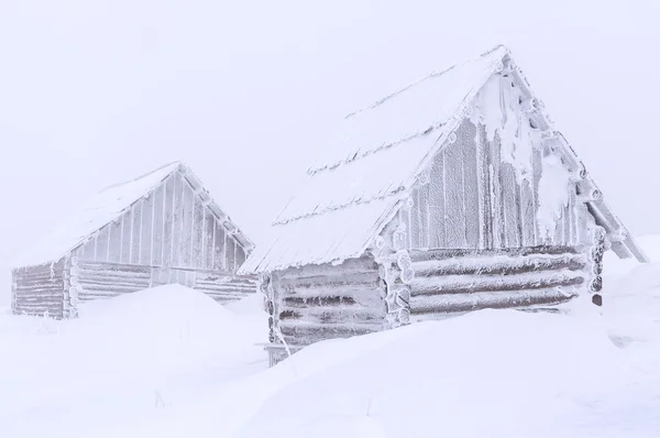 Cabins in snow drift