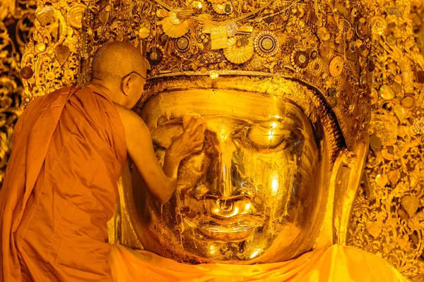 The senior monk wash Mahamuni Buddha