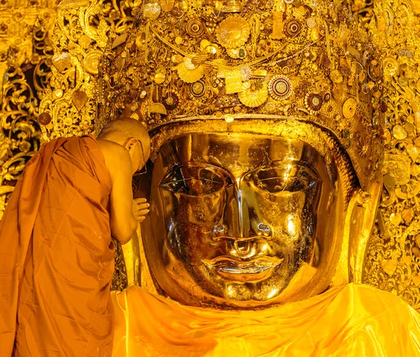 The senior monk wash Mahamuni Buddha