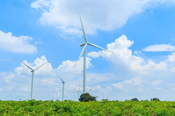 Wind turbines over sky