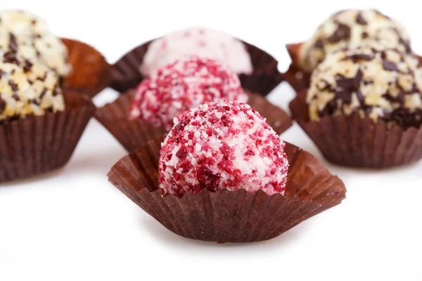 Homemade vegetarian truffle candies isolated on white background