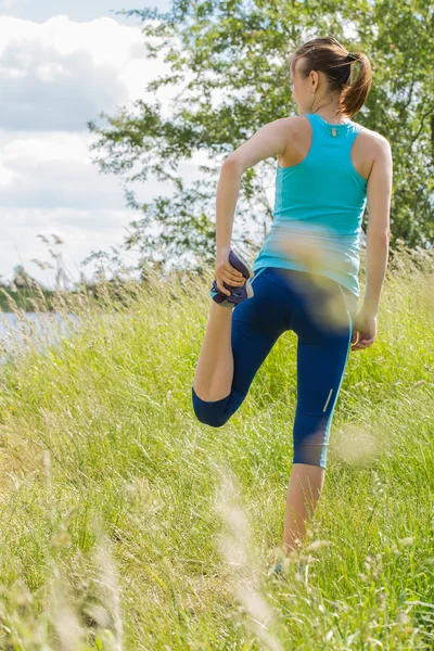 Woman stays outdoor in the morning sport workout.