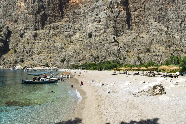 Tourists visit famous Butterfly Valley beach near Oludeniz in Turkey