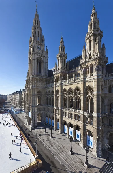 Ice skaters at Wiener Eistraum in front of the City Hall of Vienna