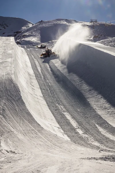 Halfpipe of famous ski resort in Austria with snowcat working
