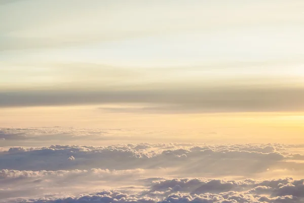 High above the clouds with beautiful sunset light