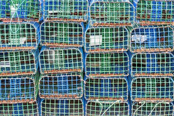 Stacked lobster and crab traps in the port of Santa Luzia
