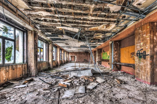 Dilapidated function room in an abandoned hotel