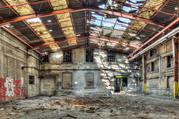 Collapsed roof in an abandoned factory warehouse