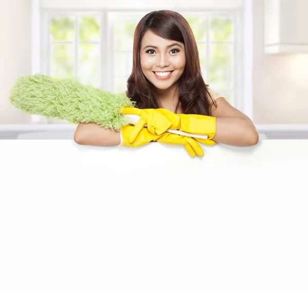 Cleaning service woman presenting blank board