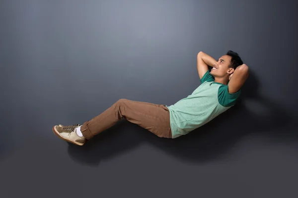 A handsome man floating with sleeping pose