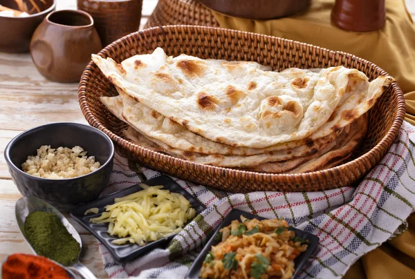 Indian naan bread with some ingredients of indian food